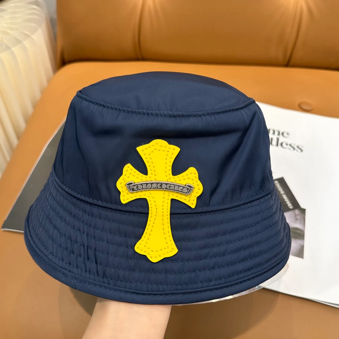P70 Chrome Hearts CH Crank Bait Navy leather cross fisherman hat, same style for men and women. Custom-woven and dyed navy blue and yellow nylon fabrics, hand-cut imported colorless yellow crosses, and 925 silver scrolls.